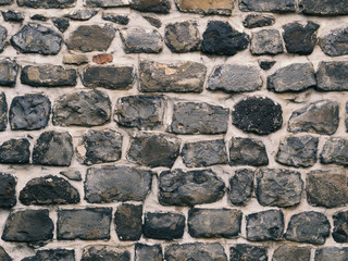 Wall built with natural stones. wall image for background applications