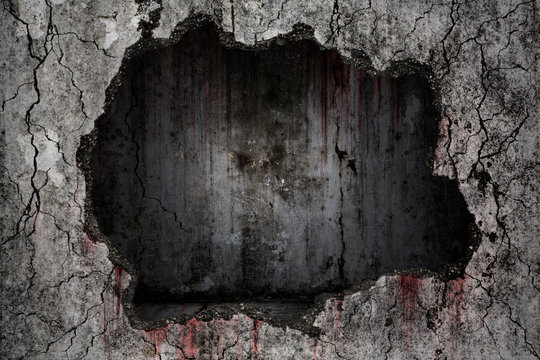 Bloody background scary on damaged grungy crack and broken concrete wall with empty dark room inside on the wall, concept of horror