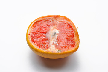Ripe half of pink grapefruit citrus fruit isolated on white background