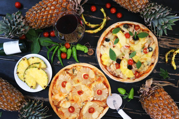 Pineapple pizza served with wine