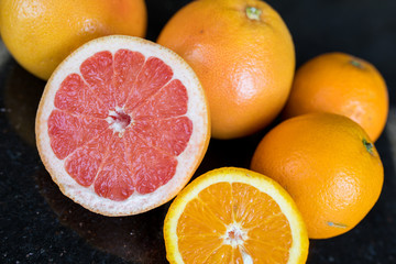 Grapefruit citrus fruits and grapefruit slice on the table