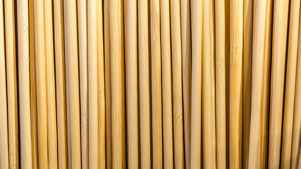 Round wooden sticks background. Close-up Wall Pattern