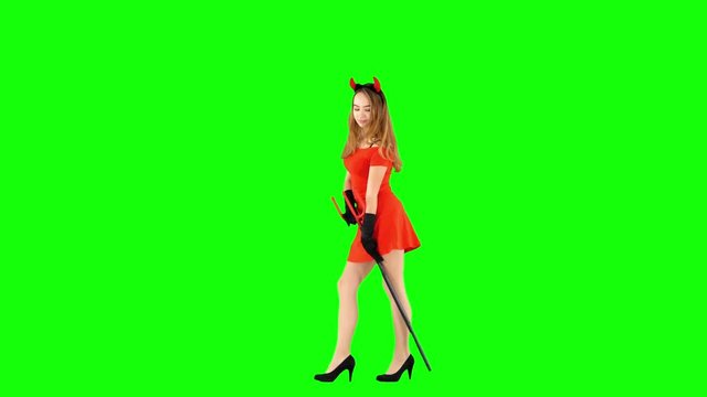 Pretty Female in Devil Halloween Costume Dancing on Green Screen