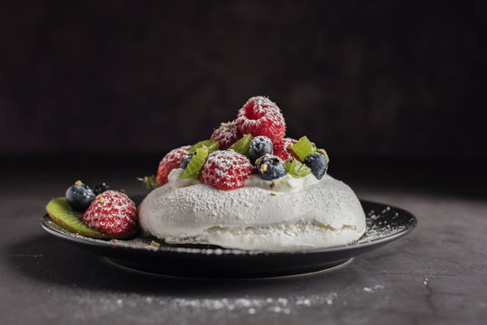 Homemade Pavlova Meringue Cake With Blueberries Strawberries Raspberries Kiwi And Powder Sugar Horizontal Copyspace Closeup Stock Photo Adobe Stock