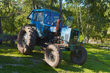 Old tractor in willage
