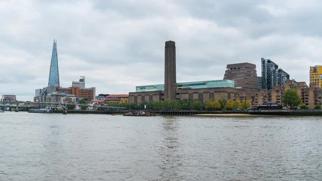 Daytime London cityscape across the River Thames with a view of the Shard, Tate Modern and Millennium Bridge.