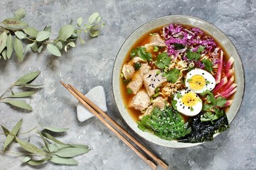 Asian ramen soup is beautiful with beef brisket, purple Peking cabbage, watermelon radish and algae. Asian cuisine. copy space. place for text. top view