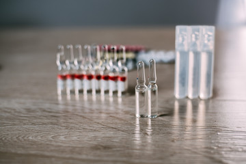 glass ampoules standing on the table with reflection transparent and clean