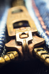 background. iron lock on blue jeans. macro close up.