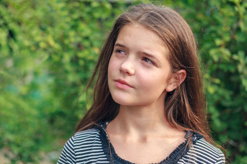 Fototapeta premium Portrait of a beautiful girl in the nature