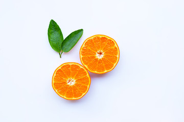High vitamin C. Fresh orange citrus fruit with leaves isolated on white