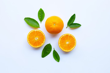 High vitamin C. Fresh orange citrus fruit with leaves isolated on white