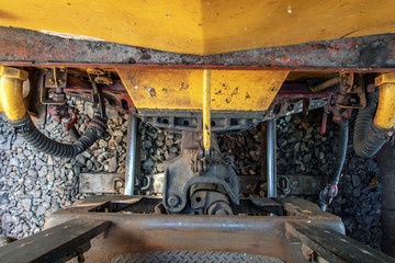 A connect between old train on railways. Connecting coupling device between railway wagon on locomotive at rail track.