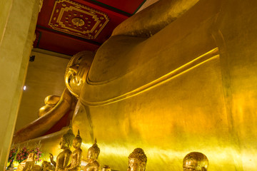 The famous reclining Buddha in Buddhist church in Phetchaburi, Thailand