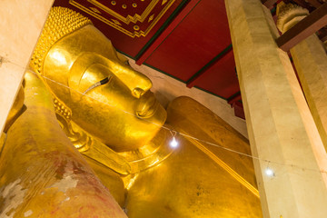 The famous reclining Buddha in Buddhist church in Phetchaburi, Thailand