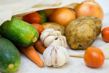 Organic farm vegetables in reusable fabric bag
