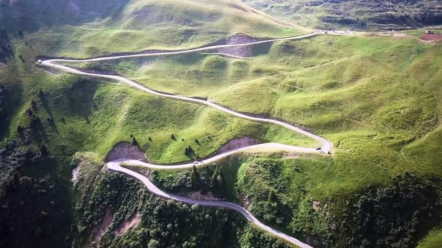 Aerial: Cars driving on a Switchback Road 