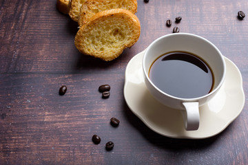 Cup of coffee with garlic bread