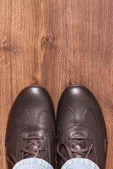 Elegant stylish brown shoes for men on board, place for inscription