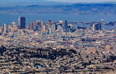 Aerial view of downtown San Francisco and Financial District sky scrapers flying over Glen Park...