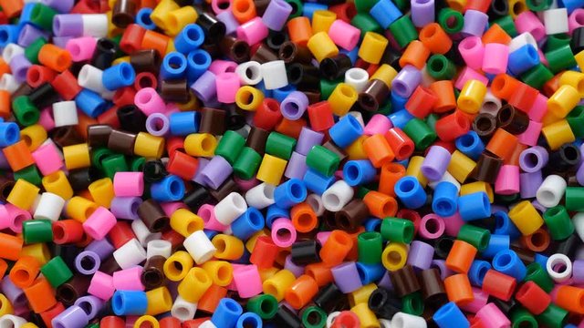 Colorful fusible plastic beads. Close up.