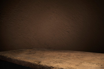 Old wood table with flame effect on dark background.