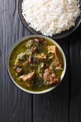 Ghormeh Sabzi Persian Herb Stew with meat and beans closeup in a bowl. Vertical top view