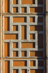 The pattern on the concrete wall of the facade of the dormitory building. Wall decoration in Soviet times.