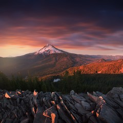 Dramatic and Majestic View of Mt. Hood on a bright, colorful sunset during the summer months. The Pacific Northwest, Oregon, USA Mount Hood reflecting in Lake in Mount Hood National Forest 