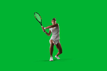 Girl tennis player on green background.