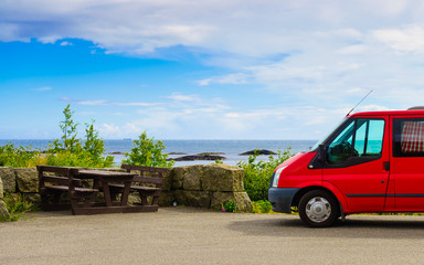 Camper car on coast of Norway with ocean view