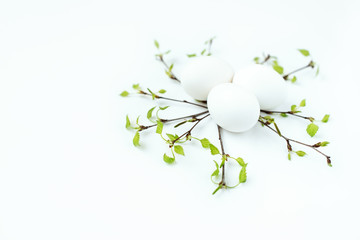 Obraz na płótnie Canvas happy Easter eggs and branch white background 