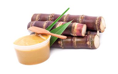 sugar cane and brown sugar on white isolate background