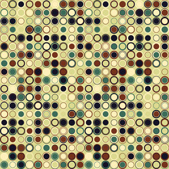 Colorful geometric seamless pattern. The elements have round shape and different color, arranged on light green. Useful as design element for texture and artistic composition.