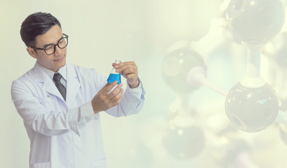 young man scientist in chemistry lab