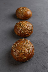 Burger buns on black background.