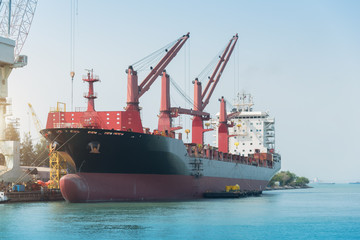 Fototapeta premium Floating crane in the dock yard terminal for repairing in shipyard, painting and cleaning in dock yard