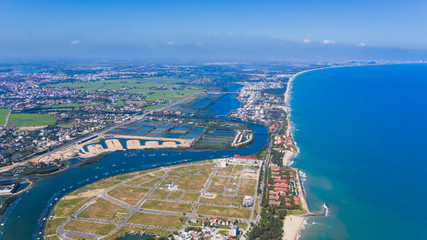 Obraz premium Hoi An and Danang drone aerial top view of the river swinging along the turquoise sea coast, Vietnam