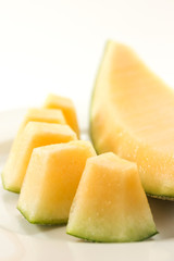 Fresh melons sliced on plate
