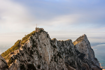 Fototapeta na wymiar Panorama of top of Gibraltar Rock (United Kingdom), in Upper Rock Natural Reserve: on the left town and bay, La Linea town in Spain at the far end, Mediterranean Sea on the right.