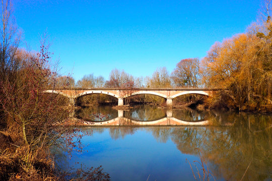 beautiful brick bridge on the river "Le Loing" near Montargis in the region Center-Val-de-Loire