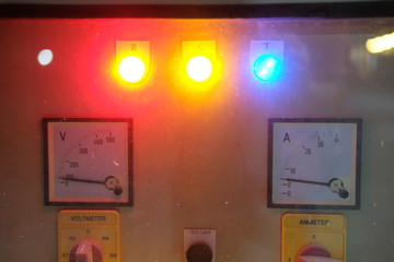 Ampermetry voltmeter on dashboard, blurred light