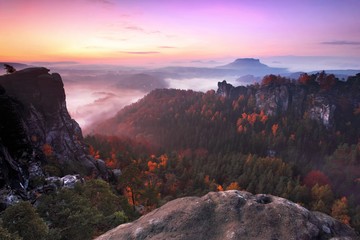 The famous Schrammsteine and the Lilienstein, Panorama view at the Elb Sandstone Mountains, Germany The rock formation Schrammsteine in the saxonian switzerland at sunrise