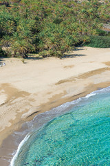 Scenic landscape of palm trees, turquoise water and tropical beach, Vai, Crete, Greece.