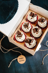Gift set of cupcakes on a black background