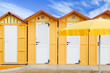 Yellow beach huts on Adriatic sea resort Rimini, Italy  