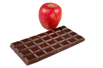 single apple red vs chocolate bar in weight concept in white background