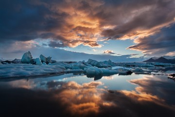 Beautiful sunset over famous Jokulsarlon glacier lagoon, Iceland. This is most popular place in Iceland. Dramatic sky sunset. Gorgeous natural seascape in the summer time. Amazing background concept