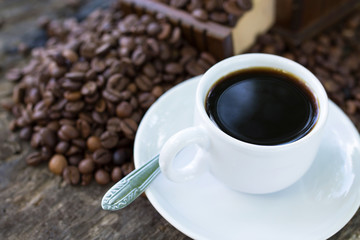 Espresso Coffee Cup With Beans On Vintage Table