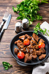 Roasted or stewed beef meat with tomato
